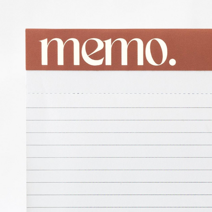 Embossed header feature of minimalist student notepad with ruled layout